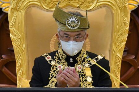 (FILES) This handout photo from Malaysia's Department of Information taken and released on May 18, 2020 shows Malaysia's King Sultan Abdullah Sultan Ahmad Shah wearing a face mask as he offers prayers during the opening ceremony for the third term of the 14th parliamentary session in Kuala Lumpur. - Malaysia's King Sultan Abdullah Sultan Ahmad Shah on January 12, 2021 declared a nationwide state of emergency to fight a surge in COVID-19 coronavirus cases that threatens to overwhelm the country's healthcare system. (Photo by NAZRI RAPAAI / Malaysia's Department of Information / AFP) / -----EDITORS NOTE --- RESTRICTED TO EDITORIAL USE - MANDATORY CREDIT "AFP PHOTO / MALAYSIA'S DEPARTMENT OF INFORMATION/  NAZRI RAPAAI " - NO MARKETING - NO ADVERTISING CAMPAIGNS - DISTRIBUTED AS A SERVICE TO CLIENTS