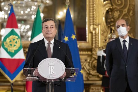 This photo taken and handout on February 12, 2021 by the Quirinale Palace Press Office shows Italy's new prime minister, former European Central Bank President Mario Draghi (L) addressing the media on February 12, 2021 following a meeting with Italy's President at the Quirinale presidential palace in Rome. - The 73-year-old economist was expected to lead a new national unity government to replace Giuseppe Conte's centre-left coalition, which collapsed one month ago, leaving the country rudderless in an unprecedented crisis. (Photo by Handout / Quirinale Press Office / AFP) / RESTRICTED TO EDITORIAL USE - MANDATORY CREDIT "AFP PHOTO / QUIRINALE PRESIDENTIAL PALACE / HANDOUT " - NO MARKETING - NO ADVERTISING CAMPAIGNS - DISTRIBUTED AS A SERVICE TO CLIENTS