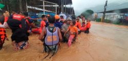 Philippine Coast Guard personnel assist in the evacuation of residents due to flooding caused by Typhoon Rai in Cagayan De Oro City, Philippines, December 16, 2021. Philippine Coast Guard/ Handout via REUTERS. THIS IMAGE HAS BEEN SUPPLIED BY A THIRD PARTY. NO RESALES. NO ARCHIVES. MANDATORY CREDIT