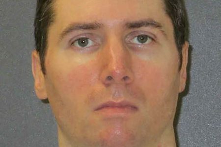 0_Justen-Hall-appears-in-an-undated-prison-photo-in-Polunsky