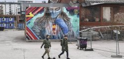 epa08385467 A view of a mural depicting a superhero character in protective gear, painted by a group of street artists in Helsinki, Finland, 26 April 2020, to pay tribute with to people working on the frontline of the coronavirus crisis.  EPA-EFE/KIMMO BRANDT