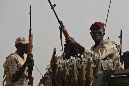 Sudanese soldiers from the Rapid Support Forces unit which led by Gen. Mohammed Hamdan Dagalo, the deputy head of the military council, secure the area where Dagalo attends a military-backed tribe's rally, in the East Nile province, Sudan, Saturday, June 22, 2019. Sudan's protest leaders say they are meeting with an Ethiopian envoy over proposals to resume negotiations with the ruling military council. (AP Photo/Hussein Malla)