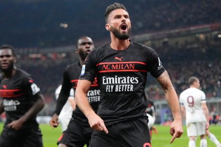 AC Milan's Olivier Giroud celebrates after scoring his side's opening goal during a Serie A soccer match between AC Milan and Torino, at the San Siro stadium, in Milan, Italy, Tuesday, Oct. 26, 2021. (AP Photo/Luca Bruno)