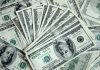 16439817-large-amount-of-money-american-dollars-cash-hundred-dollar-banknotes-mixed-together-