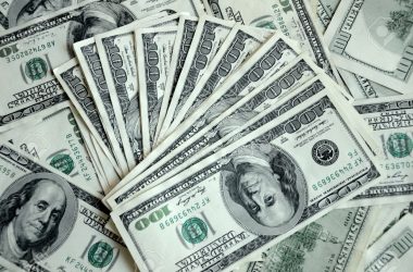 16439817-large-amount-of-money-american-dollars-cash-hundred-dollar-banknotes-mixed-together-