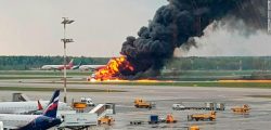 In this image provided by Riccardo Dalla Francesca shows smoke rises from a fire on a plane at Moscow's Sheremetyevo airport on Sunday, May 5, 2019. (Riccardo Dalla Francesca via AP)