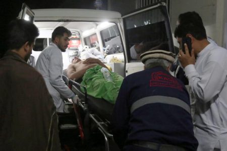 A wounded man is carried to a hospital after an explosion at wedding hall in Kabul, Afghanistan, Sunday, Aug.18, 2019.An explosion ripped through a wedding hall on a busy Saturday night in Afghanistan's capital and dozens of people were killed or wounded, a government official said. Hundreds of people were believed to be inside.(AP Photo/Nishanuddin Khan)