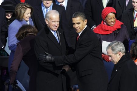 President Barack Obama greets Vice President Joe Biden, left, after Obama took the oath of office at the U.S. Capitol in Washington, Tuesday, Jan. 20, 2009. (AP Photo/Jae C. Hong)