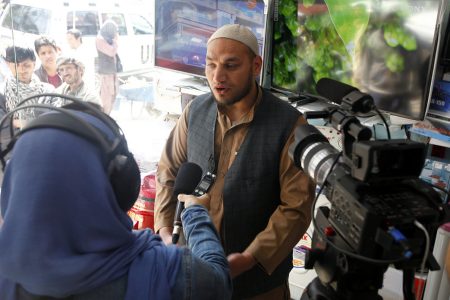 KABUL, 12 April 2016 - Afghan man are interviewing by Afghan Radio-TV Journalist in Nader Pashtun street is the popular place for selling electronics items such as TV, photo cameras, video cameras, satellite, radio, sound system, dishtv, towers, mobiles, house equipment etc. and also repairing shops located there as well. 

Photo by Fardin Waezi / UNAMA