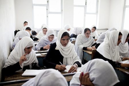 FILE -- Female Afghan students work during a class at the Jamal Agha Girls School in Kapisa Province, Afghanistan, June 29, 2010. The numbers of attacks on schools are down to an average of about eight  a month, less than half the monthly average recorded by the Education Ministry the previous two years. (Adam Ferguson/The New York Times)