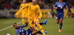 Australia's Mathew Leckie (C) tackles Nepal's Anjan Bista (bottom L) in the World Cup Qatar 2022 qualification round 2 football match between Australia and Nepal at the GIO Stadium in Canberra on October 10, 2019. (Photo by SAEED KHAN / AFP) / --IMAGE RESTRICTED TO EDITORIAL USE - STRICTLY NO COMMERCIAL USE-- (Photo by SAEED KHAN/AFP via Getty Images)
