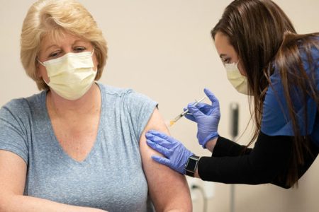 RN Clinical Staff Educator Diane Mikelsons receives a mock Pfizer vaccine for the coronavirus disease (COVID-19) during a staff vaccine training session at UW Health in Madison, Wisconsin, U.S., December 8, 2020. Picture taken December 8, 2020.  John Maniaci/UW health/Handout via REUTERS    NO RESALES. NO ARCHIVES. THIS IMAGE HAS BEEN SUPPLIED BY A THIRD PARTY.