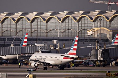 An American Airlines Group Inc. Embraer 175 plane taxis at Reagan National Airport (DCA) in Arlington, Virginia, U.S., on Monday, April 6, 2020. U.S. airlines are applying for federal aid to shore up their finances as passengers stay home amid the coronavirus pandemic. Photographer: Andrew Harrer/Bloomberg via Getty Images