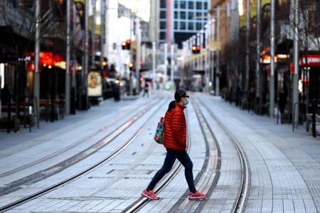 A near-empty street in the central business district of Sydney, Australia, on Tuesday, July 27, 2021. Sydney's??month-long??lockdown shows no signs of being eased as the city's daily Covid-19 cases keep climbing, even as other Australian cities move to open back up after bringing their clusters under control. Photographer: Brendon Thorne/Bloomberg