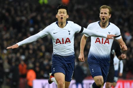 LONDON, ENGLAND - NOVEMBER 24:  Heung-Min Son celebrates after scoring his team's third goal with teammate Harry Kane of Tottenham Hotspur during the Premier League match between Tottenham Hotspur and Chelsea FC at Tottenham Hotspur Stadium on November 24, 2018 in London, United Kingdom.  (Photo by David Ramos/Getty Images)