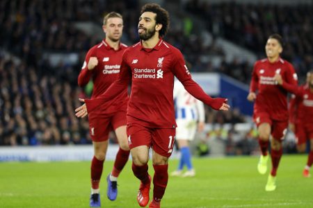 BRIGHTON, ENGLAND - JANUARY 12:  Mohamed Salah of Liverpool celebrates after scoring his team's first goal from the penalty spot during the Premier League match between Brighton & Hove Albion and Liverpool FC at American Express Community Stadium on January 12, 2019 in Brighton, United Kingdom.  (Photo by Bryn Lennon/Getty Images)