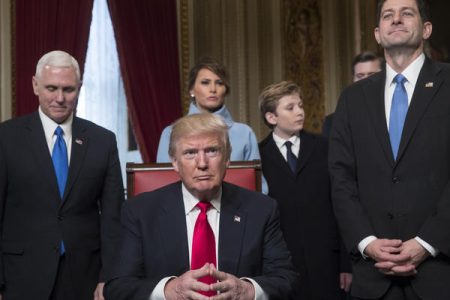 President Donald Trump is joined by the Congressional leadership and his family before formally signing his cabinet nominations into law on Jan. 20 in the President's Room of the Senate on Capitol Hill in Washington. From left are, Vice President Mike Pence, the president's wife Melania Trump, their son Barron Trump, and House Speaker Paul Ryan.
