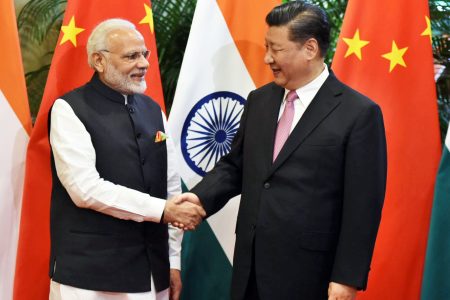 Chinese President Xi Jinping (R) shakes hands with Indian Prime Minister Narendra Modi during their visit at East Lake Guest House, in Wuhan, China, April 27, 2018. India's Press Information Bureau/Handout via REUTERS ATTENTION EDITORS - THIS PICTURE WAS PROVIDED BY A THIRD PARTY. NO RESALES. NO ARCHIVE