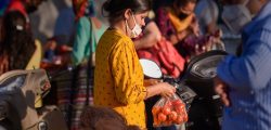 Ghaziabad: People wearing face masks buy essential items in a market during the nationwide lockdown imposed in the wake of coronavirus pandemic, in Ghaziabad, Wednesday, April 8, 2020. The Uttar Pradesh government on Wednesday decided to completely seal hotspots in 15 districts of the state till April 15 in an attempt to avoid community spread of the virus. (PTI Photo/Atul Yadav) (PTI08-04-2020_000220B)