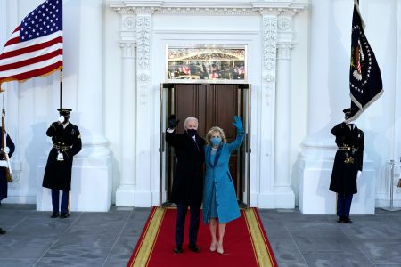 President Joe Biden and first lady Jill Biden wave as they arrive at the North Portico of the White House, Wednesday, Jan. 20, 2021, in Washington. (AP Photo/Alex Brandon, Pool)