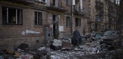 A resident carries a suitcase with his belongings after his building was heavily damaged by bombing in Kyiv, Ukraine, Friday, March 18, 2022. Russian forces pressed their assault on Ukrainian cities Friday, with new missile strikes and shelling on the edges of the capital Kyiv and the western city of Lviv, as world leaders pushed for an investigation of the Kremlin’s repeated attacks on civilian targets, including schools, hospitals and residential areas. (AP Photo/Felipe Dana)