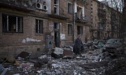 A resident carries a suitcase with his belongings after his building was heavily damaged by bombing in Kyiv, Ukraine, Friday, March 18, 2022. Russian forces pressed their assault on Ukrainian cities Friday, with new missile strikes and shelling on the edges of the capital Kyiv and the western city of Lviv, as world leaders pushed for an investigation of the Kremlin’s repeated attacks on civilian targets, including schools, hospitals and residential areas. (AP Photo/Felipe Dana)