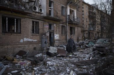 A resident carries a suitcase with his belongings after his building was heavily damaged by bombing in Kyiv, Ukraine, Friday, March 18, 2022. Russian forces pressed their assault on Ukrainian cities Friday, with new missile strikes and shelling on the edges of the capital Kyiv and the western city of Lviv, as world leaders pushed for an investigation of the Kremlin’s repeated attacks on civilian targets, including schools, hospitals and residential areas. (AP Photo/Felipe Dana)