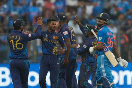 Sri Lanka's Dilshan Madushanka celebrates the wicket of India's Shreyas Iyer with teammates during the ICC Men's Cricket World Cup match between India and Sri Lanka in Mumbai, India, Thursday, Nov. 2, 2023. (AP Photo/Rajanish Kakade)