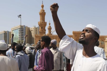 People chant slogans to protest Sudanese President of the Sovereignty Council Abdel Fattah Abdelrahman Burhan's contentious decision to meet Israel's prime minister last week in a move toward normalizing relations, in Khartoum, Sudan, Friday, Feb. 7, 2020. (AP Photo/Marwan Ali)