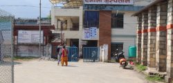 Two persons standing in front of Damauli Hospital in Tanahun district, on Tuesday, March 31, 2020. Photo: Madan Wagle/ THT