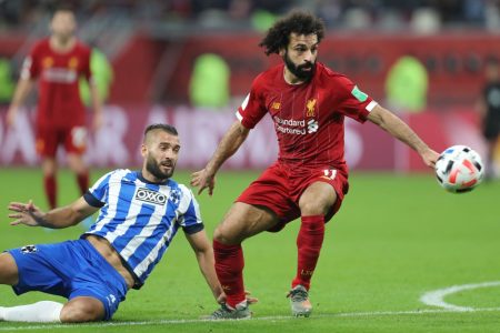 Liverpool's Egyptian midfielder Mohamed Salah (R) dribbles past Monterrey's defender Nicolas Sanchez during the 2019 FIFA Club World Cup semi-final football match between Mexico's Monterrey and England's Liverpool at the Khalifa International Stadium in the Qatari capital Doha on December 18, 2019. (Photo by KARIM JAAFAR / AFP) (Photo by KARIM JAAFAR/AFP via Getty Images)