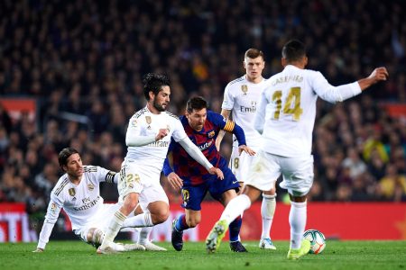 BARCELONA, SPAIN - DECEMBER 18: Lionel Messi of FC Barcelona tries to control the ball surrounded by Sergio Ramos, Francisco Alarcon 'Isco', Toni Kroos and Casemiro of Real Madrid CF during the Liga match between FC Barcelona and Real Madrid CF at Camp Nou on December 18, 2019 in Barcelona, Spain. (Photo by Alex Caparros/Getty Images)