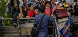MANILA, PHILIPPINES - MARCH 14: Filipinos hoping to get on flights out of Manila hours before it is placed on lockdown queue at Ninoy Aquino International Airport on March 14, 2020 in Manila, Philippines. Philippine President Rodrigo Duterte announced on Thursday that he would place some 12 million people in the capital Manila on lockdown and suspend government work for a month to prevent the spread of COVID-19. The Philippines' Department of Health has so far confirmed 98 cases of the deadly coronavirus in the country, with at least 8 recorded fatalities. (Photo by Ezra Acayan/Getty Images)