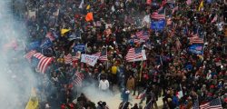 TOPSHOT - Trump supporters clash with police and security forces as they storm the US Capitol in Washington D.C on January 6, 2021. - Demonstrators breeched security and entered the Capitol as Congress debated the a 2020 presidential election Electoral Vote Certification. (Photo by ROBERTO SCHMIDT / AFP) (Photo by ROBERTO SCHMIDT/AFP via Getty Images)