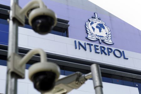 epa04703664 Security cameras pictured against the Interpol logo on the Interpol Global Complex for Innovation building (IGCI) in Singapore, 14 April 2015. Interpol's first digital crime centre was officially opened in Singapore on 13 April 2015. Complementing its headquarters in Lyon, the Interpol Global Complex for Innovation (ICGI) will support international policing efforts against cybercrime, as well as research and capacity building in online security.  EPA/WALLACE WOON