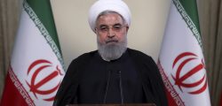 In this photo released by official website of the office of the Iranian Presidency, President Hassan Rouhani addresses the nation in a televised speech in Tehran, Iran, Tuesday, May 8, 2018. Iranian President Hassan Rouhani said Tuesday he'd send his foreign minister to negotiate with countries remaining in the nuclear deal after Donald Trump's decision to pull America from the deal, warning he otherwise would restart enriching uranium "in the next weeks." (Iranian Presidency Office via AP)