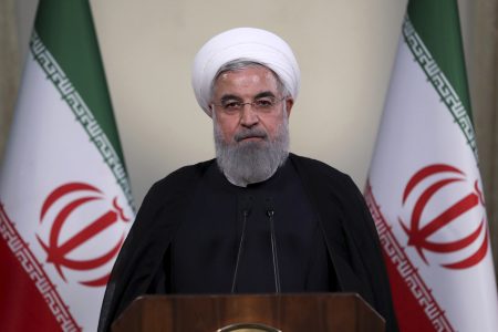 In this photo released by official website of the office of the Iranian Presidency, President Hassan Rouhani addresses the nation in a televised speech in Tehran, Iran, Tuesday, May 8, 2018. Iranian President Hassan Rouhani said Tuesday he'd send his foreign minister to negotiate with countries remaining in the nuclear deal after Donald Trump's decision to pull America from the deal, warning he otherwise would restart enriching uranium "in the next weeks." (Iranian Presidency Office via AP)