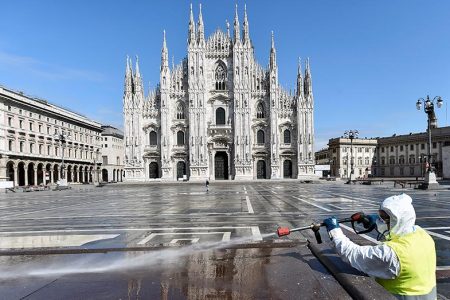 A worker wearing protective garments sanitises the Duomo square, during the coronavirus disease (COVID-19) outbreak in central Milan, Italy March 31, 2020. Photo: Reuters