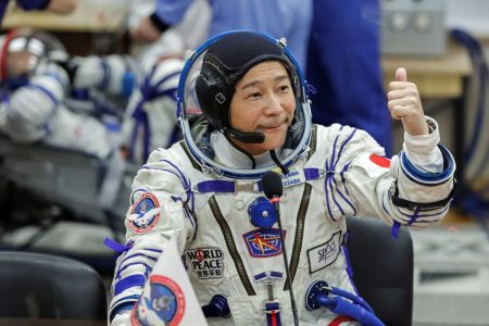 Japanese entrepreneur Yusaku Maezawa reacts as he speaks with his family after donning space suits shortly before the launch to the International Space Station (ISS) at the Baikonur Cosmodrome, Kazakhstan, December 8, 2021.  REUTERS/Shamil Zhumatov