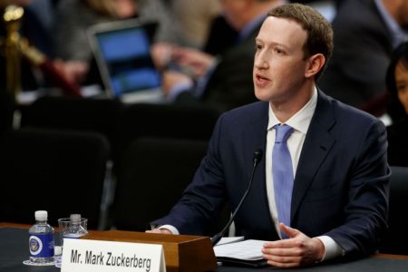 (180410) -- WASHINGTON, April 10, 2018 (Xinhua) -- Facebook CEO Mark Zuckerberg testifies at a joint hearing of the Senate Judiciary and Commerce committees on Capitol Hill in Washington D.C., United States, on April 10, 2018. Facebook CEO Mark Zuckerberg told Congress in written testimony on Monday that he is "responsible for" not preventing the social media platform from being used for harm, including fake news, foreign interference in elections and hate speech. (Xinhua/Ting Shen)