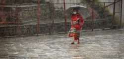 A woman with umbrella passing through Hanumandhoka durbar square during rainfall in Kathmandu on Tuesday. Photo: Naresh Shrestha