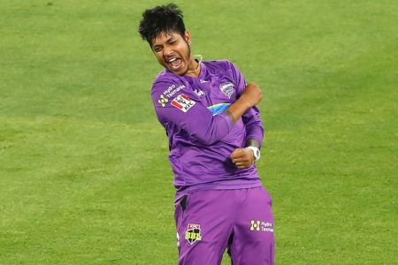 MELBOURNE, AUSTRALIA - JANUARY 24: Sandeep Lamichhane of the Hurricanes celebrates taking the wicket of Jordan Silk of the Sydney Sixers during the Big Bash League match between the Sydney Sixers and Hobart Hurricanes at Melbourne Cricket Ground, on January 24, 2021, in Melbourne, Australia. (Photo by Robert Cianflone/Getty Images)