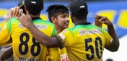TAROUBA, TRINIDAD AND TOBAGO - AUGUST 22: Sandeep Lamichhane (2R) and Glenn Phillips (2L) of Jamaica Tallawahs celebrate the dismissal of Sherfane Rutherford (L) of Guyana Amazon Warriors during the Hero Caribbean Premier League match 8 between Guyana Amazon Warriors and Jamaica Tallawahs at Brian Lara Cricket Academy on August 22, 2020 in Tarouba, Trinidad And Tobago. (Photo by Randy Brooks - CPL T20/CPL T20 via Getty Images)