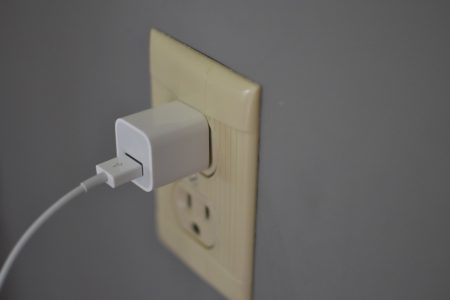 Siri-Remote-charging-with-wall-plug-adapter-hero