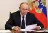 Russian President Vladimir Putin takes part in a televised meeting with officials to discuss forest fires at a residence outside Moscow, Russia August 24, 2022. Sputnik/Mikhail Klimentyev/Kremlin via REUTERS