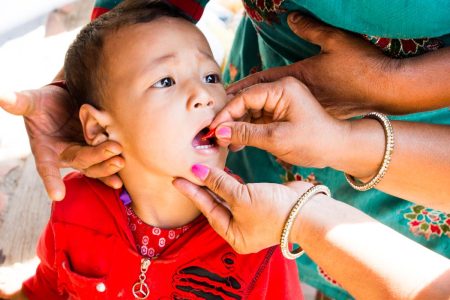 Vitamin-A being administered to a child
