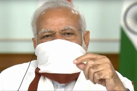 **EDS: VIDEO GRAB** New Delhi: Prime Minister Narendra Modi wearing a protective mask chairs a meeting with chief ministers on COVID-19 lockdown via video conference, in New Delhi, Saturday, April 11, 2020. (PTI Photo)
(PTI11-04-2020_000044B)