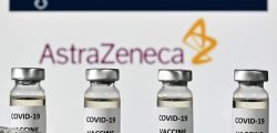 An illustration picture shows vials with Covid-19 Vaccine stickers attached and syringes, with the logo of the University of Oxford and its partner British pharmaceutical company AstraZeneca, on November 17, 2020. (Photo by JUSTIN TALLIS / AFP)