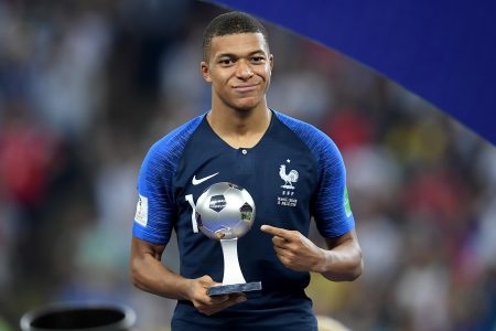 MOSCOW, RUSSIA - JULY 15:  Kylian Mbappe of France celebrates with his Best Young Player Award following the 2018 FIFA World Cup Final between France and Croatia at Luzhniki Stadium on July 15, 2018 in Moscow, Russia.  (Photo by Matthias Hangst/Getty Images)