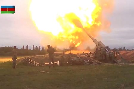 A video still shows members of Azeri armed forces firing artillery during clashes between Armenia and Azerbaijan over the territory of Nagorno-Karabakh in an unidentified location, from footage released Sept. 28. Defence Ministry of Azerbaijan via REUTERS
